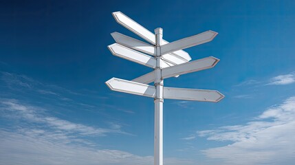 Signpost with blank arrows against a vibrant blue, cloudy sky