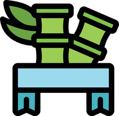 Bamboo shoots and leaves growing behind a light blue ribbon banner with copy space