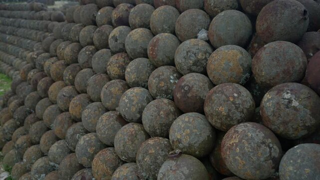 Close-up of old, rusty cannonballs stacked at Citadelle Laferri&egrave;re, historic military ammunition, fortress in Haiti