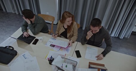 University students collaborating on a project, discussing ideas and analyzing data in a classroom setting. - Powered by Adobe