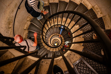 High Angle View of a Spiral Metal Staircase with People