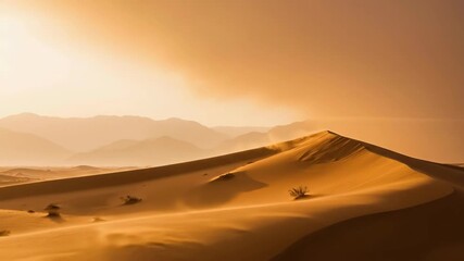 Vertical video of wind blowing sand across golden desert dunes. Majestic landscape with mountains in the background during a hazy sunrise. Arid nature cinemagraph with copy space - Powered by Adobe
