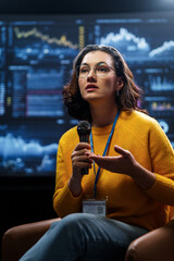 woman is giving a presentation at conference