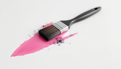 Paintbrush leaving vibrant pink color streak with splattered dark particles on clean bright surface