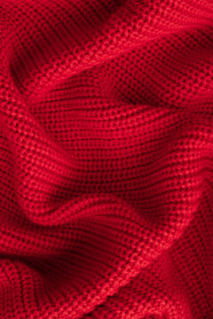 Knitted red background. Top view, vertical image