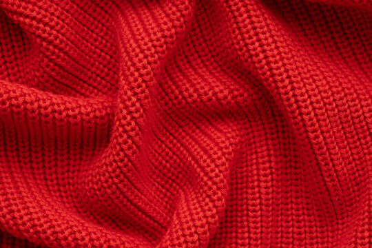 Knitted red background. Top view