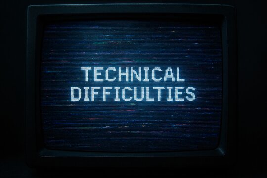 Digital glitch screen with technical difficulties text and static noise