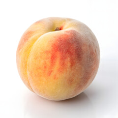 Whole ripe peach with fuzzy skin showing red and yellow hues on a white background