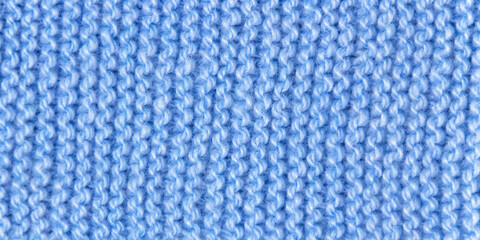 The texture of blue knitted wool fabric