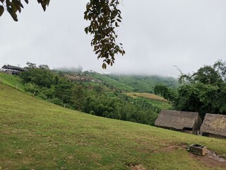 mountain view with cloudy sky on background