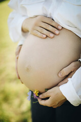 pregnant woman holding her belly
