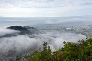 Beautiful view from Corcovado mountain over Brazilian city of Rio de Janeiro on a foggy spring day. Photo taken October 12th, 2025, Rio de Janeiro, Brazil.