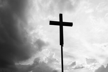 A christian cross under the dark sky