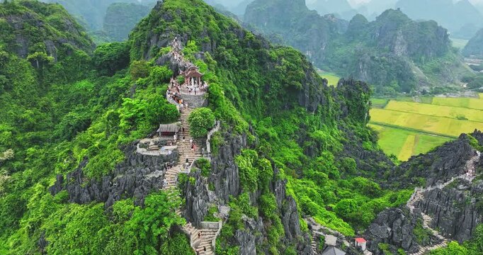 Lying Dragon mountain viewpoint, Stunning view of Tam Coc area with mountain range, rice fields. It is such as Great Wall in Ninh Binh, Vietnam