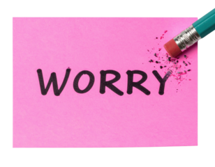 A pink note with the word "WORRY" being erased by a pencil eraser, symbolizing the act of letting go of concerns.