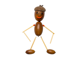 A whimsical figure made from acorns and toothpicks, featuring a smiling face and playful demeanor.
