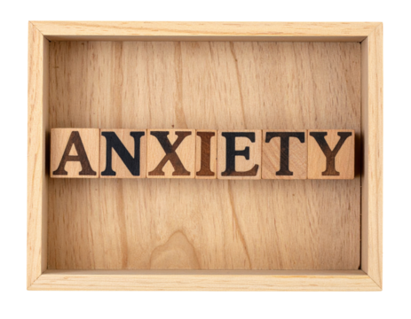 The image features wooden blocks arranged to spell the word "ANXIETY" within a wooden frame. - Powered by Adobe