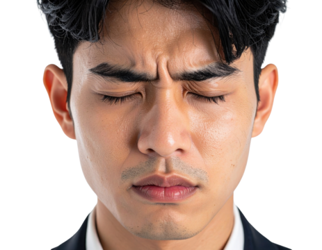 A close-up of a man with closed eyes, displaying a serious expression and focused features.