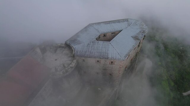 Citadelle Laferriere shrouded in clouds, Haiti. Aerial top-down orbiting
