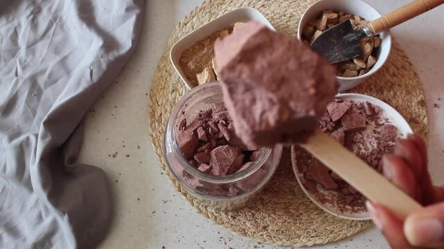 Red clay stone in white plates flat lay