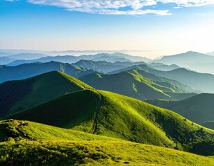 Lush, grassy hills stretch to hazy blue mountain ranges