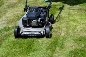 Lawn mower on green grass