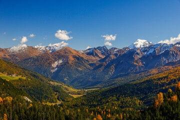 Obraz premium Autumn landscape of Val Mustair valley and Umbrail Pass of canton Grisons, Graubunden, Switzerland. 