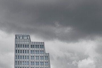 White tower under cloudy light, minimalist architecture emphasizing pure geometry, clean structure, subtle design, and modern city skyline harmony with balanced tone and texture