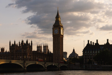 Big Ben clock tower and Westminster Bridge in warm evening light