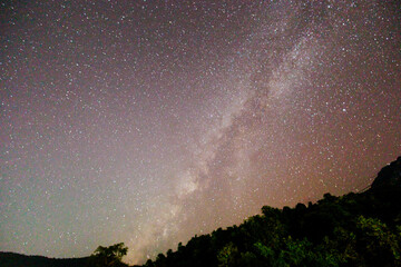 The majestic Milky Way galaxy stretches across the dark night sky.