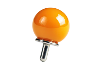 Glossy orange pushpin with metal base on black background