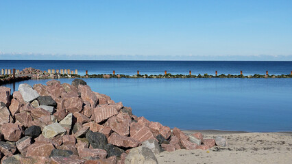 Stones for embankment reinforcement. A pile of stones on the Svetlogorsk beach to reinforce the shoreline.