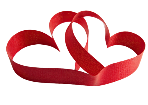 Two red ribbon hearts intertwined on a plain background