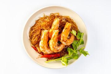 Baked shrimp with glass noodles in a plate on a white background