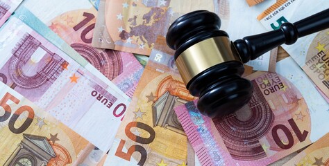 Gavel on stack of euros