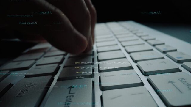 A focused programmer typing on a modern keyboard, surrounded by digital code elements. This image captures the essence of technology and software development. Xenic