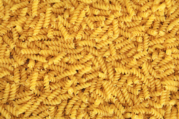 fusilli burgu makarna - uncooked italian fusilli pasta background	
