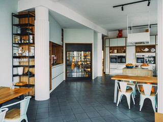 Modern show kitchen for cooking class with tables and kitchen decor