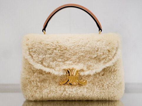 The Nino shearling bag by Celine, with its stylish design, is made from warm materials, perfect for the winter season. Milan, Italy, October 17, 2025