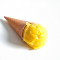 Yellow mango ice cream scoop in a waffle cone on white background  
