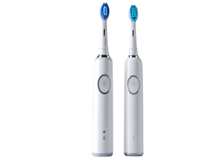 Two white electric toothbrushes with blue bristles ready for oral hygiene.