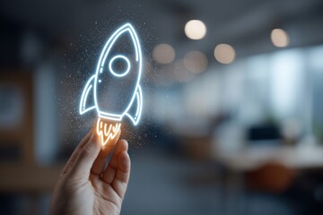 Hand Holding a Neon Rocket Illustration in Modern Office