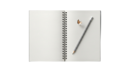 Overhead view of an open spiral notebook with blank lined pages, a gray pencil, and a wooden pencil shaving.
