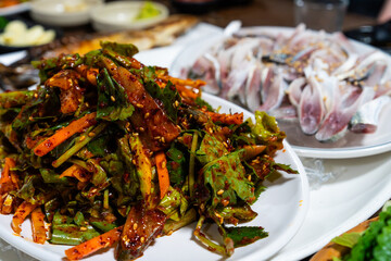 spicy marinated gizzard shad sashimi against the gizzard shad sashimi slices