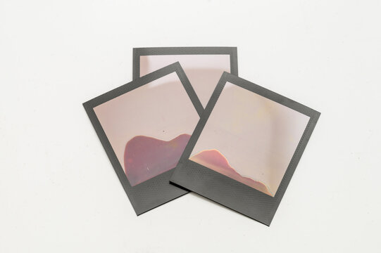 Failed Polaroid photo development &mdash; abstract patterns from improperly exposed instant film on white background