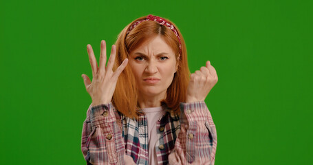 Green Screen. Chroma Key. Angry Girl Swear at Camera. Woman Wearing in Blue Shirt Feeling Nervous...