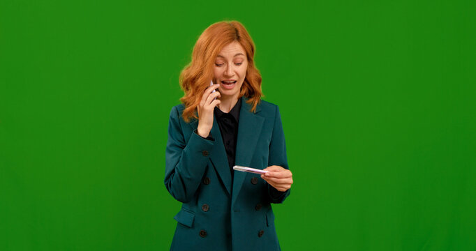 Female takes pregnancy test and makes call on smartphone entusiastic. Green screen background footage of pregnant woman receiving the news. Healthcare concept. - Powered by Adobe