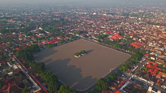 Aerial view of the Yogyakarta Palace and Alun-alun Utara is surrounded by lush greenery and traditional Javanese architecture, Yogyakarta, Daerah Istimewa Yogyakarta, Indonesia.