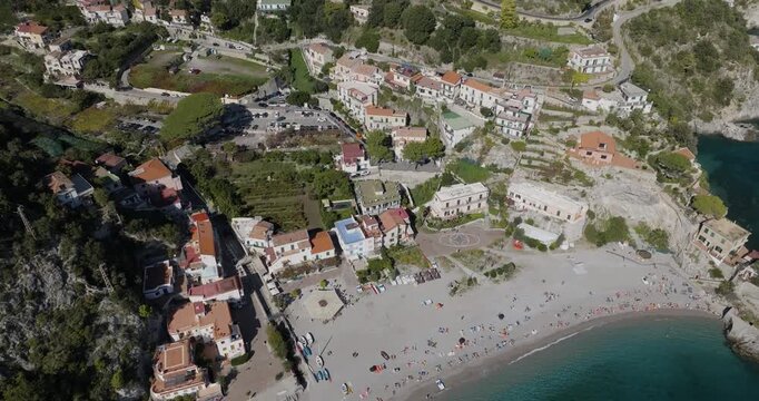 Aerial view of the vibrant Erchie, where colorful houses meet the sandy beach and the turquoise sea, creating a stunning contrast, Erchie, Amalfi Coast, Italy.