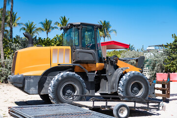 Fototapeta premium Wheel loader. Heavy equipment of wheel loader for loading materials. Wheel loader heavy machinery. Industrial heavy equipment. Wheel loader machinery. Heavy construction machines